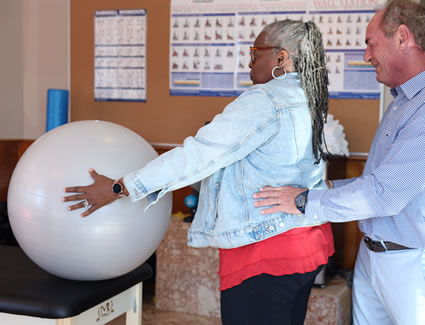 patient-holding-exercise-ball